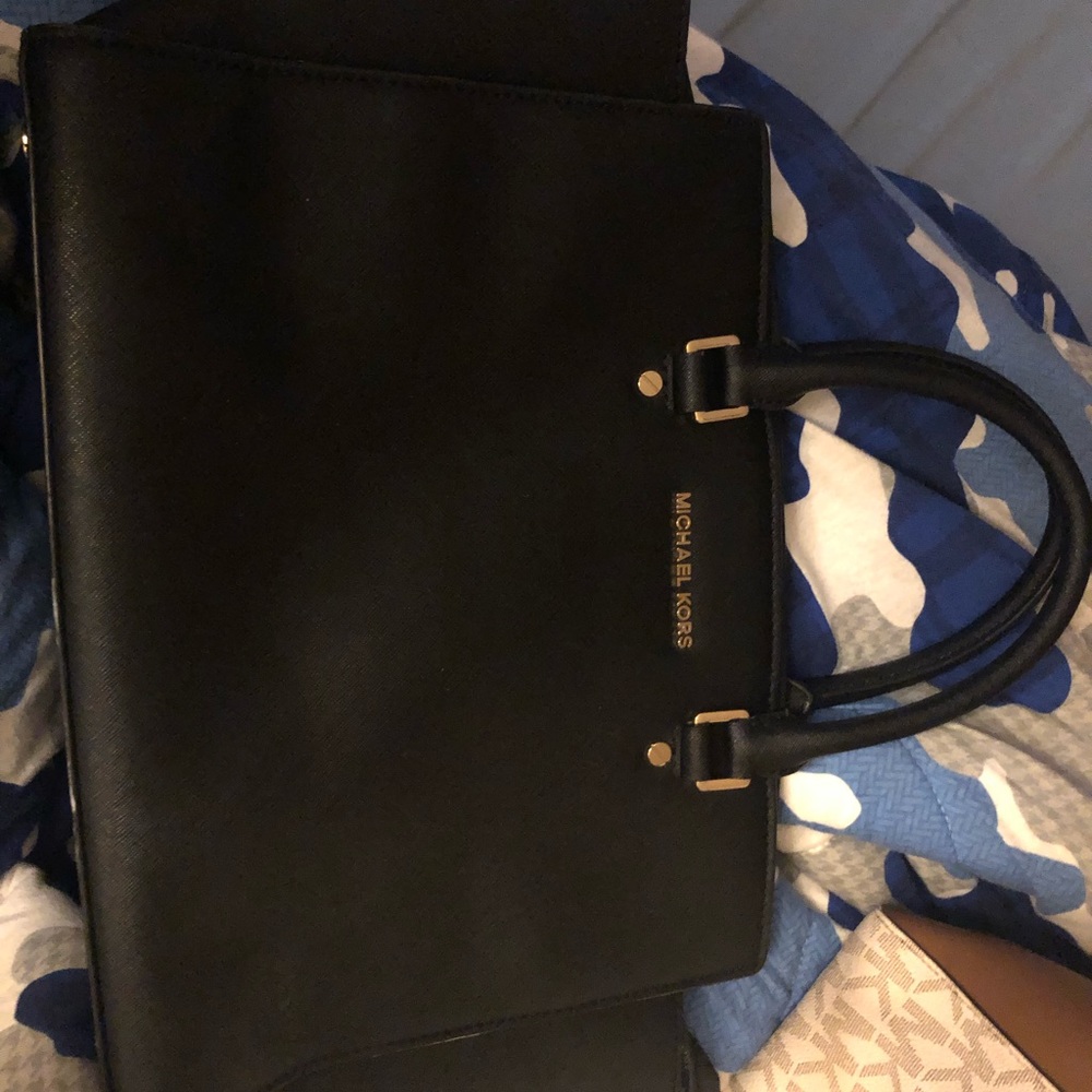 Woman’s medium sized black Michael kors purse